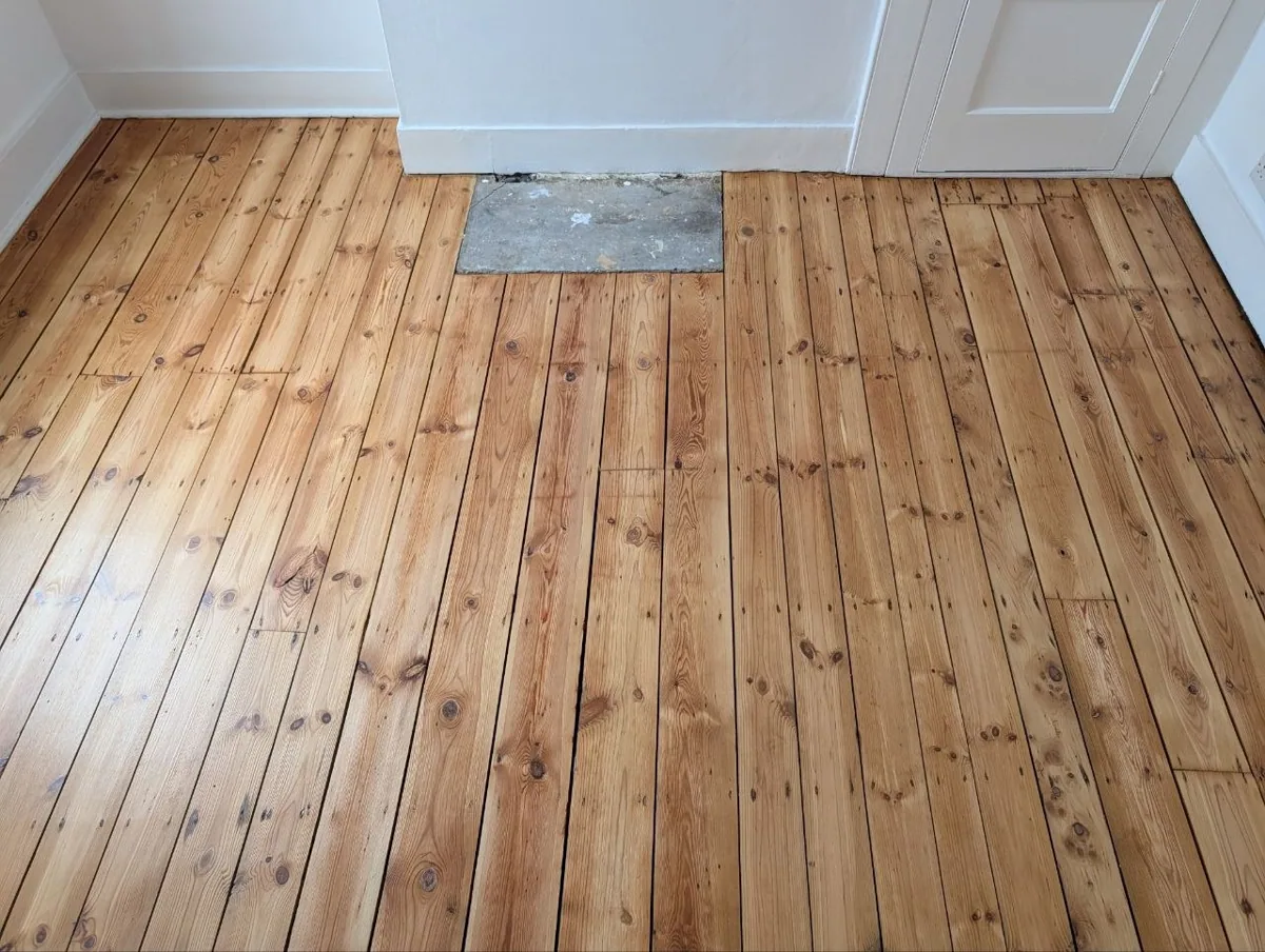 The same pine floorboards in Lewisham after sanding and refinishing