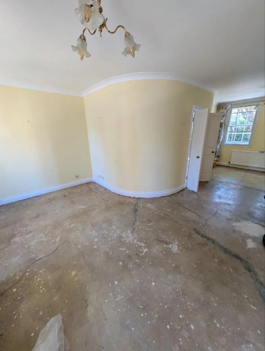 Cracked concrete screed in a Norwood house after the old floor was lifted